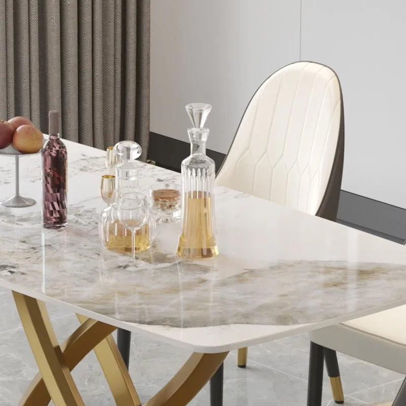 Table à manger moderne avec plateau rectangulaire en pierre frittée et piètement doré