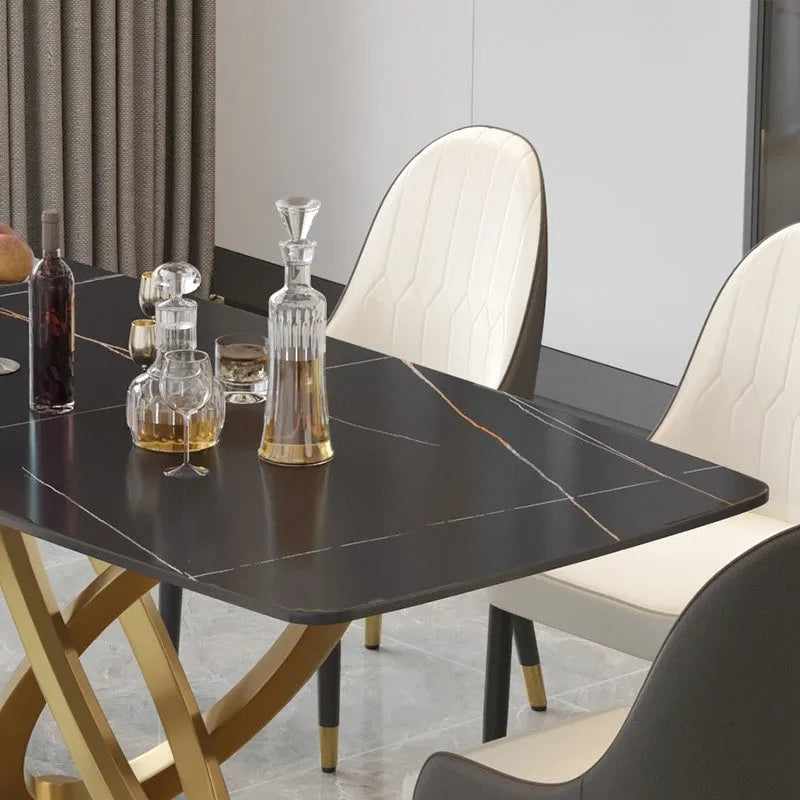 Table à manger moderne avec plateau rectangulaire en pierre frittée et piètement doré