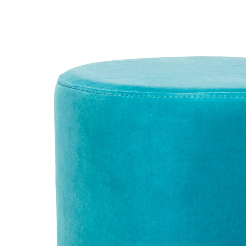 Pouffe en velours bleu marine avec base en laiton
